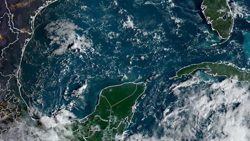 A satellite image shows an area of low pressure labeled "Potential Tropical Cyclone Nine" by the National Oceanic and Atmospheric Administration captured over the northwest Caribbean Sea on Monday, September 23, 2024. The system is expected to strengthen into a hurricane and move north toward Florida and Georgia later this week.