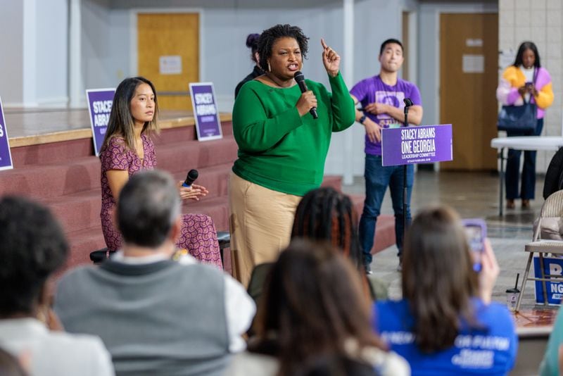 Democratic gubernatorial candidate Stacey Abrams took her “Let’s Get it Done” bus tour to Athens on Wednesday, where she rallied with young voters. She is pictured speaking at a event in Norcross on Oct. 7, 2022. (Arvin Temkar/AJC)