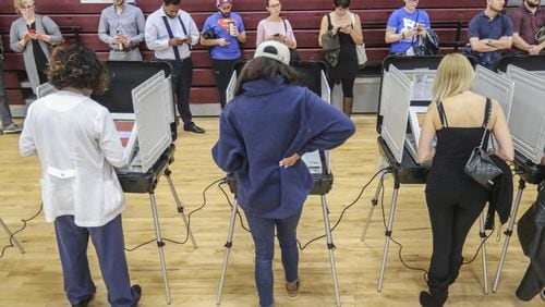 Voters waited over an hour to vote at Henry W. Grady High School in Atlanta on Election Day in 2018. Metro Atlanta polling places reported steady lines as voters went to the polls that day. JOHN SPINK/JSPINK@AJC.COM