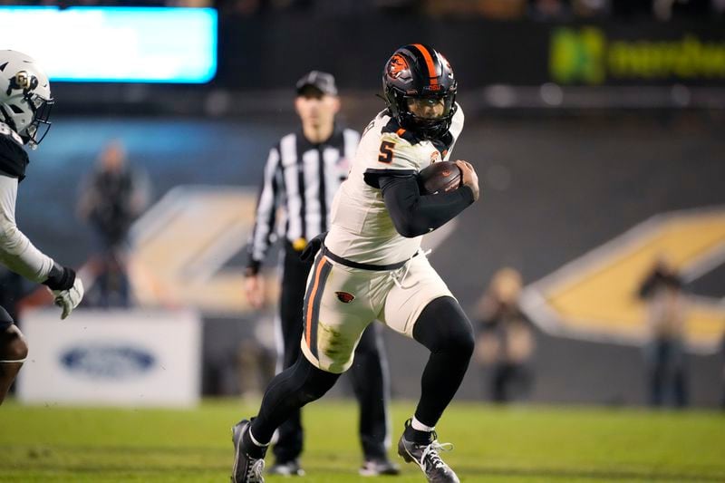 FILE - Then-Oregon State quarterback DJ Uiagalelei (5) plays in the second half of an NCAA college football game Saturday, Nov. 4, 2023, in Boulder, Colo. (AP Photo/David Zalubowski, File)