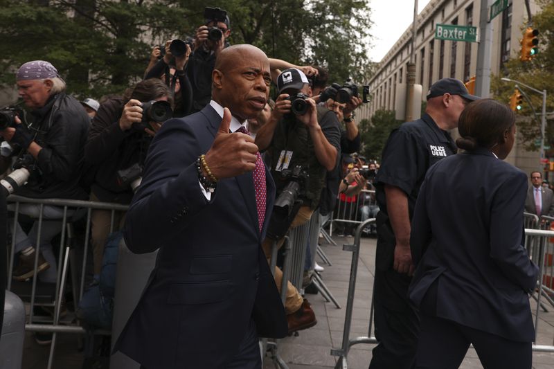 New York City mayor Eric Adams motions as he departs Manhattan federal court, Friday, Sept. 27, 2024, in New York. (AP Photo/Yuki Iwamura)