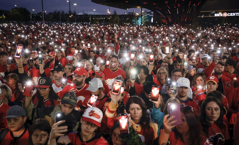 Fans attend a vigil for former Calgary Flames player Johnny Gaudreau and his brother Matthew in Calgary, Alberta., Wednesday, Sept. 4, 2024. (Jeff McIntosh/The Canadian Press via AP)