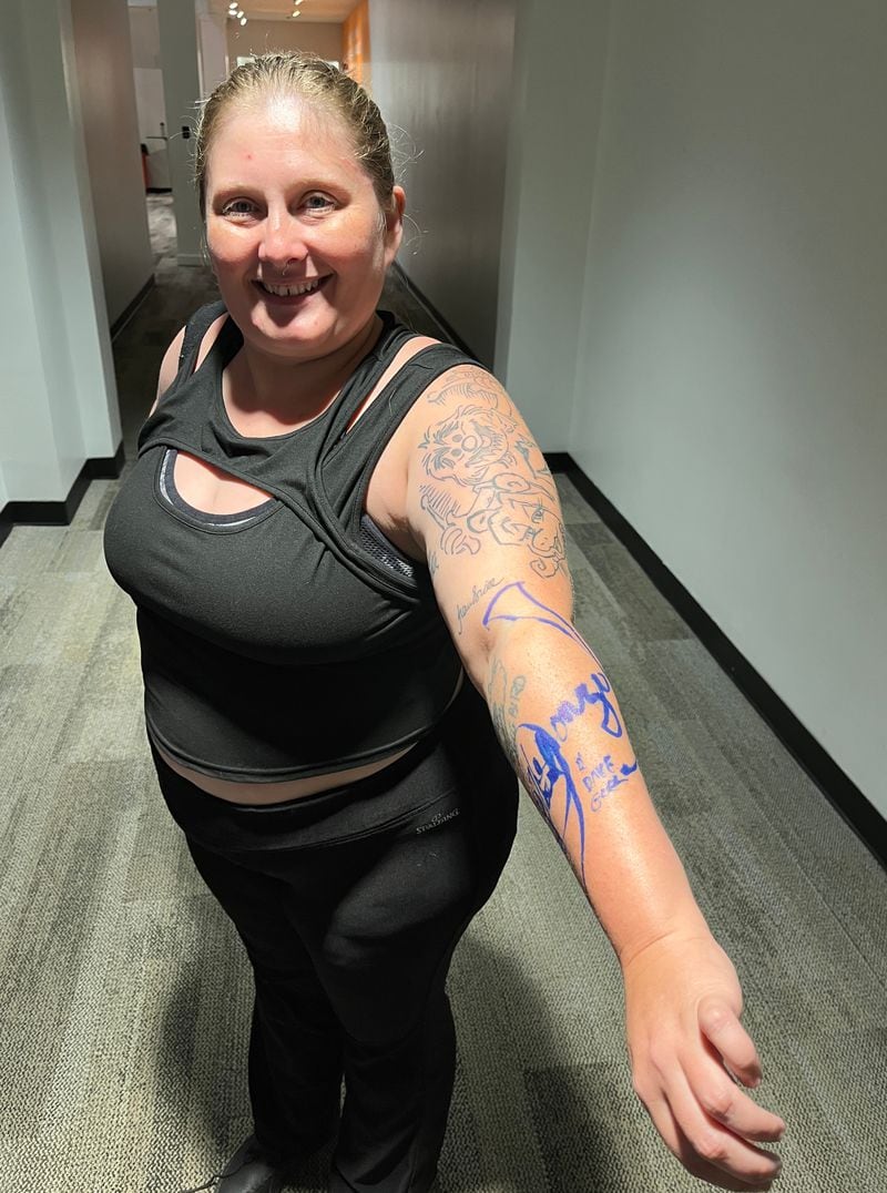 Burlesque performer Cherlyn Beatty drove from Pittsburgh to hear Dave Goelz speak, and to seek an autograph for her arm. Photo: Bo Emerson