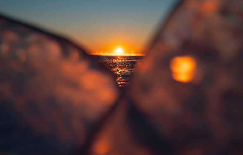 FILE - The sun rises above a frozen Lake Superior off the coast of Duluth, Minn., Feb. 9, 2021. (Alex Kormann/Star Tribune via AP, File)