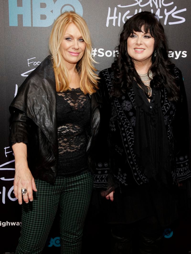FILE - Nancy Wilson, left, and Ann Wilson, of the band Heart, attend the premiere of HBO's "Foo Fighters Sonic Highway" on Oct. 14, 2014, In New York. Ann Wilson says she has cancer. The band is postponing the remaining shows on its Royal Flush Tour. (Photo by Andy Kropa/Invision/AP, File)