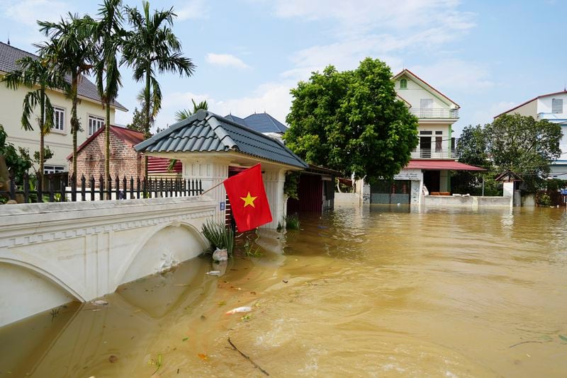 This photo shows houses submerged in flood in the aftermath of Typhoon Yagi in An Lac village, Hanoi, Vietnam Friday, Sept. 13, 2024. (AP Photo/Hau Dinh)