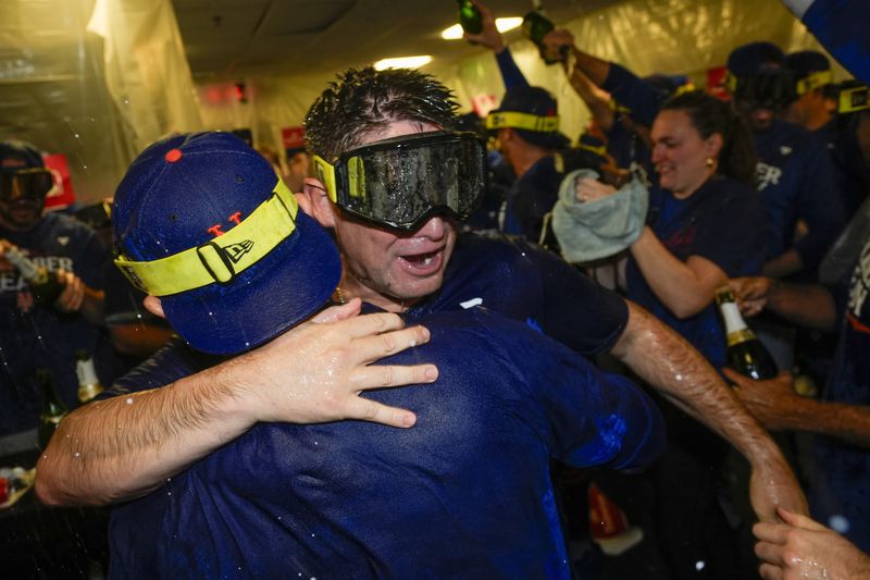 New York Mets manager Carlos Mendoza celebrates after winning Game 3 of a National League wild card baseball game against the Milwaukee Brewers Thursday, Oct. 3, 2024, in Milwaukee. The Mets won 4-2. (AP Photo/Morry Gash)