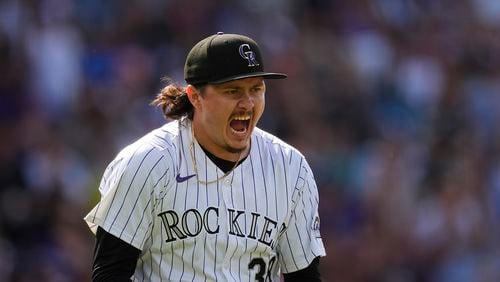 Colorado Rockies pitcher Victor Vodnik reacts after striking out Atlanta Braves' Travis d'Arnaud to end a baseball game Sunday, Aug. 11, 2024, in Denver. (AP Photo/David Zalubowski)