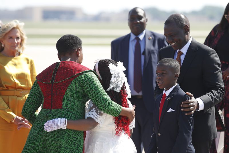 Kenya's President William Ruto, right, and first lady Rachel Ruto, second from left, arrive as first Lady Jill Biden, left, looks on at Andrews Air Force Base, Md., Wednesday, May 22, 2024, for a state visit to the United States. (AP Photo/Luis M. Alvarez)