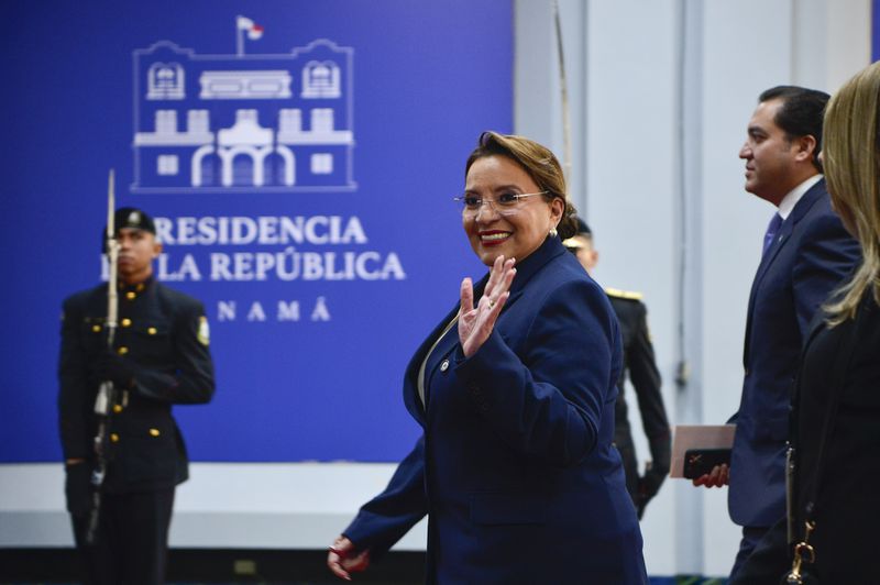 Honduran President Xiomara Castro waves to the press as she arrives at the swearing-in ceremony of Panama's President-elect Jose Raul Mulino at the Atlapa Convention Centre in Panama City, Monday, July 1, 2024. (AP Photo/Agustin Herrera)