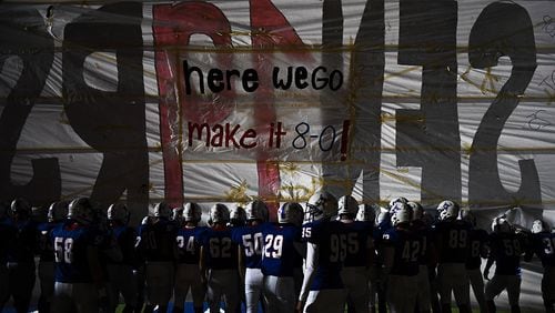 Walton players prepare to take the field against Roswell Friday, Oct. 19, 2018 in Marietta.