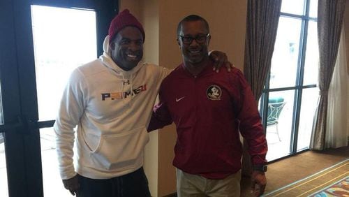 Deion Sanders poses for a photo with new FSU football coach Willie Taggart on Wednesday ahead of the Independence Bowl game in Shreveport, La. (Screenshot/ Willie Taggart's Twitter)