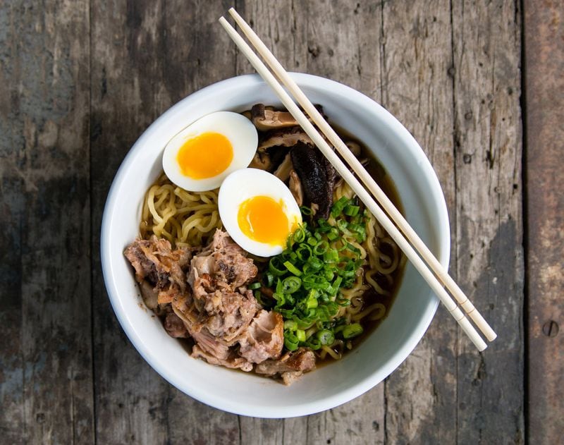 At BeetleCat, executive chef Andrew Isabella serves ramen with wavy noodles, pulled pork, scallions, mushrooms, and a medium-boiled egg. CONTRIBUTED BY HENRI HOLLIS