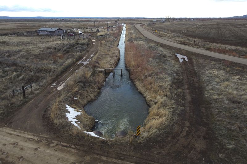 An irrigation canal is shown in Owyhee, Nev., March 13, 2024, on the Duck Valley Indian Reservation that straddles the Nevada-Idaho border. (AP Photo/Rick Bowmer)