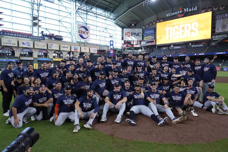 The Detroit Tigers pose for a team photo after their 5-2 win against the Houston Astros in Game 2 of an AL Wild Card Series baseball game Wednesday, Oct. 2, 2024, in Houston. (AP Photo/Kevin M. Cox)