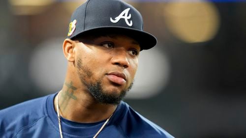 Atlanta Braves' Ronald Acuna Jr. stands in the dugout during the fifth inning of a baseball game against the Los Angeles Angels, Saturday, Aug. 17, 2024, in Anaheim, Calif. (AP Photo/Ryan Sun)