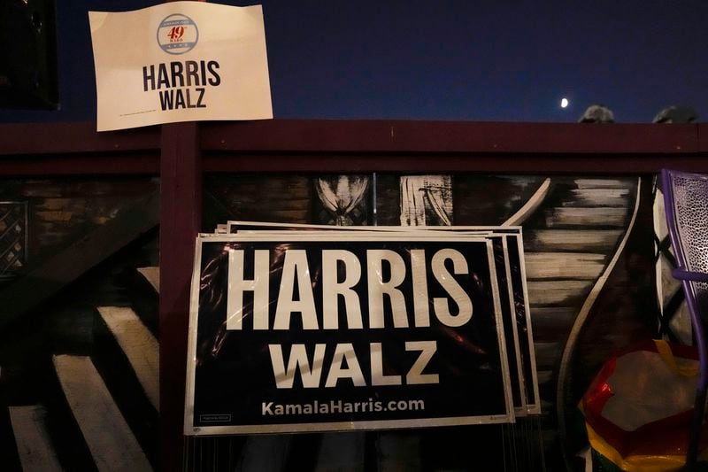 Signs for Kamala Harris and Tim Walz are posted in Jarvis Square ahead of the presidential debate between Republican presidential nominee former President Donald Trump and Democratic presidential nominee Vice President Kamala Harris, Tuesday, Sept. 10, 2024, in the Rogers Park neighborhood of Chicago. (AP Photo/Erin Hooley)