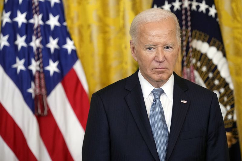 President Joe Biden listens during a Medal of Honor ceremony at the White House in Washington, Wednesday, July 3, 2024, posthumously honoring two U.S. Army privates who were part of a daring Union Army contingent that stole a Confederate train during the Civil War. U.S. Army Pvts. Philip G. Shadrach and George D. Wilson were captured by Confederates and executed by hanging. (AP Photo/Susan Wals