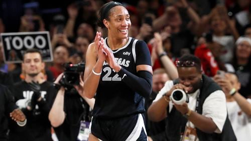 Las Vegas Aces center A'ja Wilson (22) celebrates during the second half of a WNBA basketball game against the Connecticut Sun, Sunday, Sept. 15, 2024, in Las Vegas. (Steve Marcus/Las Vegas Sun via AP)