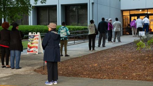 People stand in line to vote at the South Fulton Service Center early on Friday morning, May 22, 20220. STEVE SCHAEFER FOR THE AJC