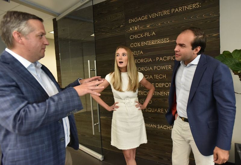 Allison Robinson, chief executive officer of The Mom Project, chats with Blake Patton (left), managing partner of Tech Square Ventures, and Thiago Olson, managing director of Engage Ventures. HYOSUB SHIN / HSHIN@AJC.COM