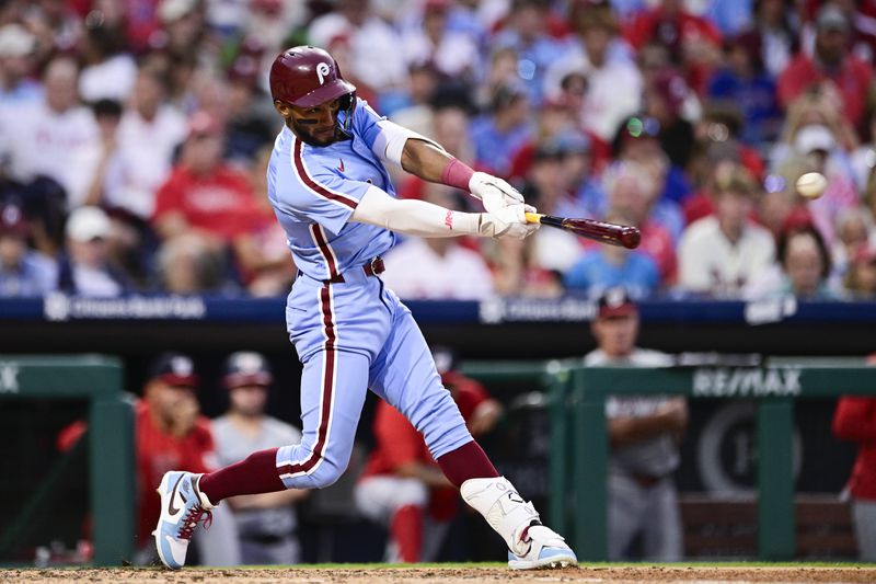 Philadelphia Phillies' Johan Rojas hits an RBI-single off Washington Nationals' Mitchell Parker during the fourth inning of a baseball game, Thursday, Aug. 15, 2024, in Philadelphia. (AP Photo/Derik Hamilton)