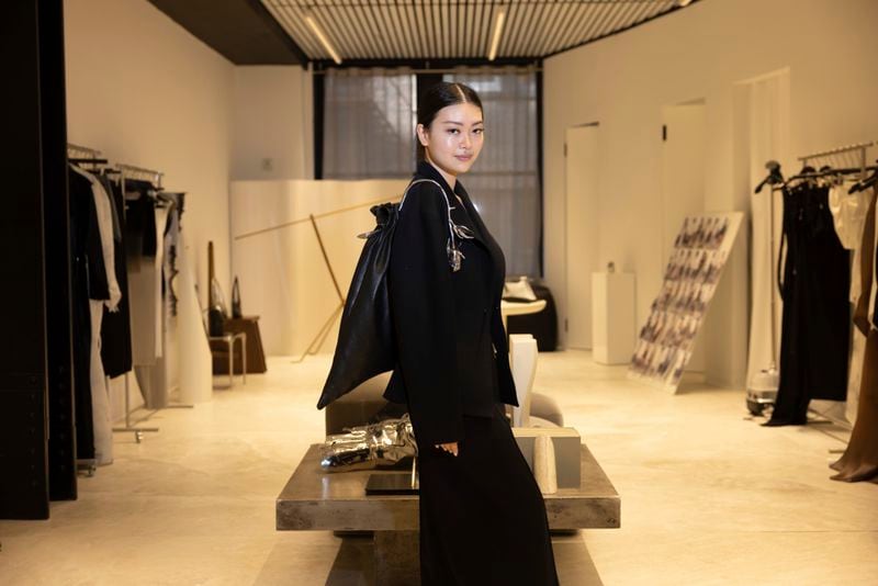 Singapore designer Grace Ling poses in her showroom where she displays her 3D printed designs on Friday, Sept. 13, 2024, in New York. Ling, a CFDA/Vogue Fashion Fund finalist, showcased her latest collection at New York Fashion Week. (Photo by Matt Licari/Invision/AP)