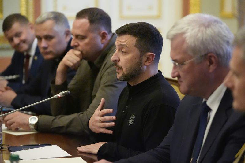 Ukraine's President Volodymyr Zelenskyy gestures during a meeting U.S. Secretary of State Antony Blinken and Britain's Foreign Secretary David Lammy at the Mariinsky Palace in Kyiv, Ukraine, Wednesday, Sept. 11, 2024. (AP Photo/Mark Schiefelbein, Pool)