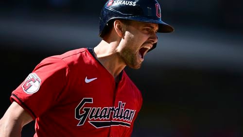 Cleveland Guardians' Lane Thomas shouts as he runs the bases after hitting a home run in the first inning during Game 1 of baseball's AL Division Series against the Detroit Tigers, Saturday, Oct. 5, 2024, in Cleveland. (AP Photo/David Dermer)