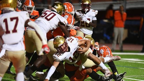 Dylan Lonergan, quarterback for Brookwood, gets tackled at the Parkview vs. Brookwood High School Football game on Friday, Oct. 28, 2022, at Parkview High School in Lilburn, Georgia. (Jamie Spaar for the Atlanta Journal Constitution)