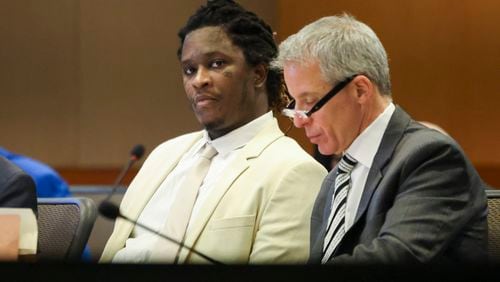 Atlanta rapper Young Thug, whose real name is Jeffery Williams, sits next to one of his defense attorneys Brian Steel, right, at the courtroom of Judge Ural Glanville at the Fulton County Courthouse, Friday, March 22, 2024, in Atlanta. (Jason Getz / jason.getz@ajc.com)
