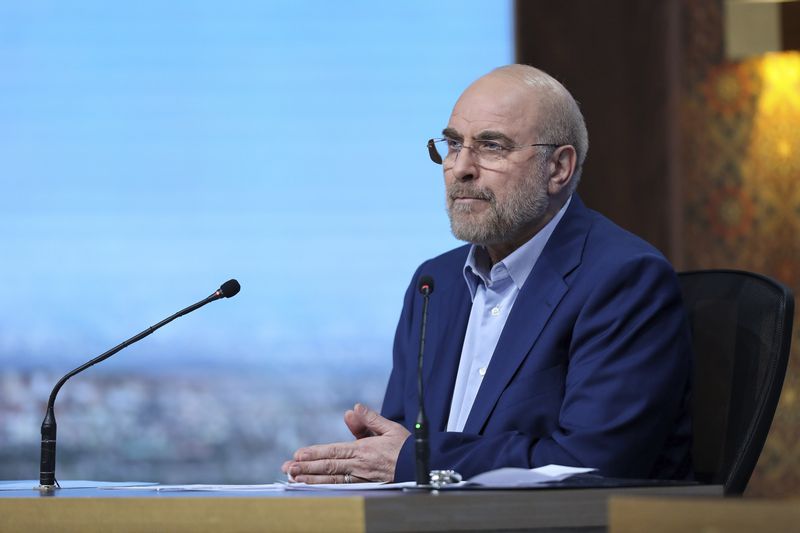 In this picture made available by Iranian state-run TV, IRIB, presidential candidate for the June 28 election Mohammad Bagher Qalibaf, who is Iran's Parliament Speaker, speaks in a debate of the candidates at the TV studio in Tehran, Iran, Tuesday, June 25, 2024. (Morteza Fakhri Nezhad/IRIB via AP)