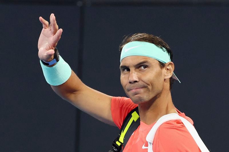 FILE - Rafael Nadal, of Spain, waves to the crowd at his doubles match against Australia's Max Purcell and Jordan Thompson during the Brisbane International tennis tournament in Brisbane, Australia, Dec. 31, 2023. This French Open is expected to be the last one for Rafael Nadal. (AP Photo/Tertius Pickard, File)