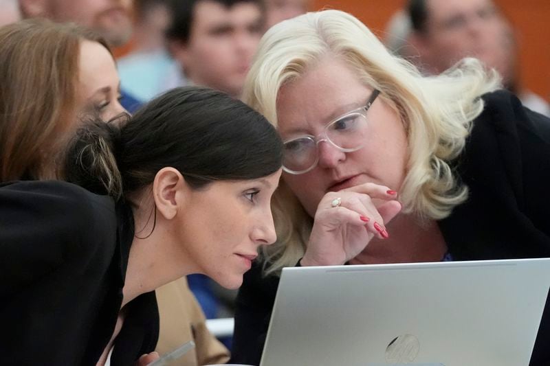 Kouri Richins, left, a Utah mother of three who wrote a children's book about coping with grief after her husband's death and was later accused of fatally poisoning him, speaks to her attorney, Kathy Nester, during a hearing Monday, Aug. 26, 2024, in Park City, Utah. (AP Photo/Rick Bowmer, Pool)