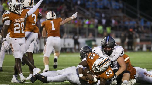 Kell defensive lineman Tyshawn Natt (99) recovers a North Atlanta fumble for a turnover during the first half of the Corky Kell Dave Hunter Classic at Kell High School, Wednesday, August 14, 2024, in Marietta, Ga. (Jason Getz / AJC)
