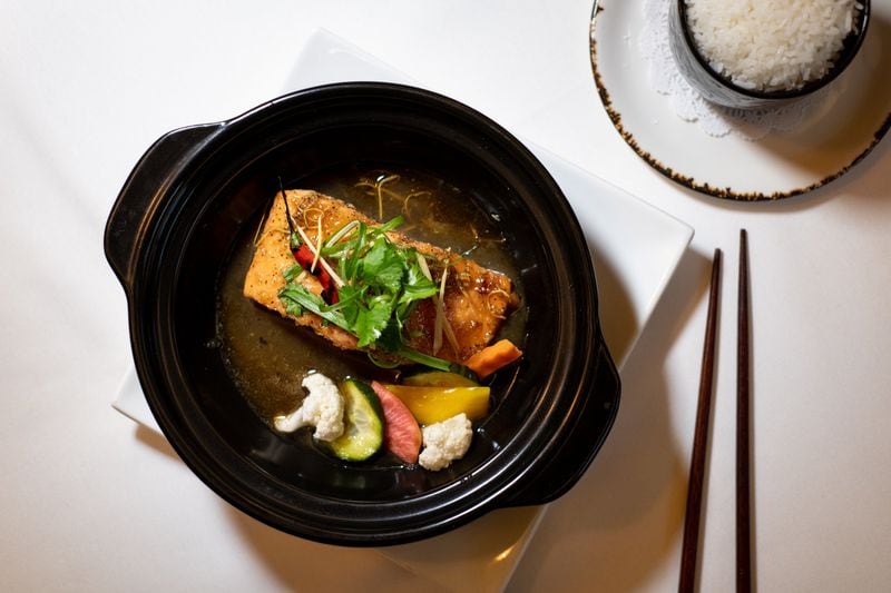 Salmon Braised in Ginger Caramel Sauce with Pickled Vegetables, served with rice. Chef Nicole Routhier says, “The sauce is sweet and salty, so you need to balance it with something sour or acidic like pickled vegetables.” STYLING BY NICOLE ROUTHIER / CONTRIBUTED BY MIA YAKEL