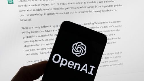 FILE - The OpenAI logo is seen on a mobile phone in front of a computer screen displaying output from ChatGPT, March 21, 2023, in Boston. State lawmakers’ first attempts at curtailing discrimination in artificial intelligence programs that play a hidden role American's lives are floundering across the country. Only Colorado's bill has been signed by the governor. (AP Photo/Michael Dwyer, File)