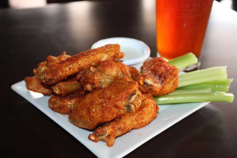 The food menu at the Brass Tap in Marietta will include chicken wings (pictured), nachos, loaded fries and tots, sandwiches, pizza and burgers. (Courtesy of the Brass Tap)