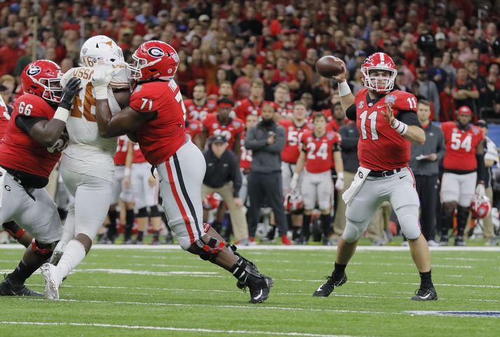 Ehlinger runs for 3 scores as Texas shocks Georgia in Sugar Bowl