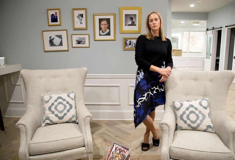 Eleanor's Place founder Jennifer Morgan stands in front of a collection of photographs of Ruth Bader Ginsburg at her private, women-only co-working space in Atlanta Saturday, September 19, 2020.  STEVE SCHAEFER / SPECIAL TO THE AJC 