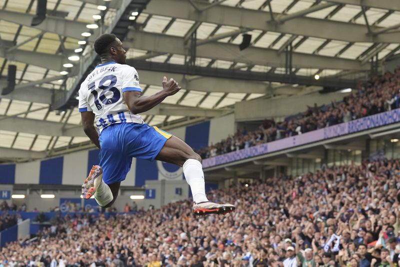 Brighton and Hove Albion's Danny Welbeck celebrates after scoring his side's second goal of the game, during the English Premier League soccer match between Brighton and Nottingham Forest, at the American Express Stadium, in Brighton and Hove, England, Sunday, Sept. 22, 2024. (Gareth Fuller/PA via AP)