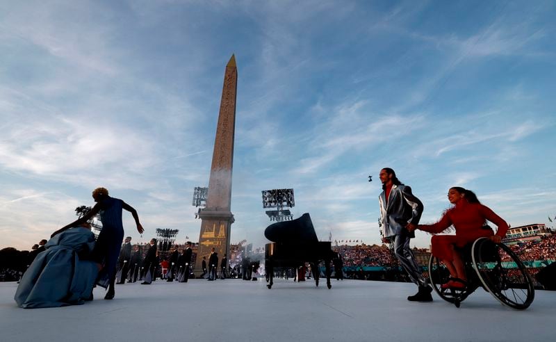 Artists perform during the Opening Ceremony for the 2024 Paralympics, Wednesday, Aug. 28, 2024, in Paris, France. (Gonzalo Fuentes/Pool Photo via AP)