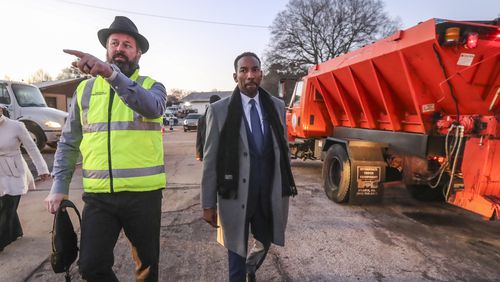 Atlanta Department of Transportation Commissioner Josh Rowan (left) talks to Mayor Andre Dickens about snow preparations at the ATL DOT North Avenue Facility in Atlanta on Friday, Jan. 14, 2022. (John Spink / John.Spink@ajc.com)