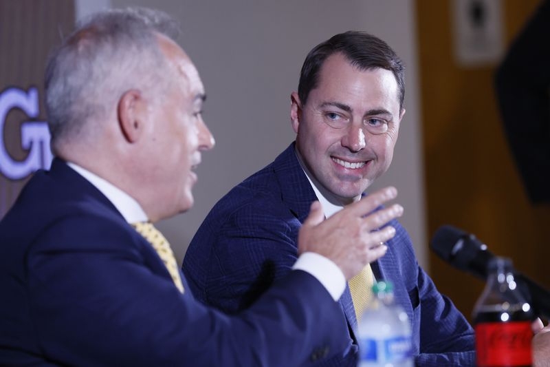 The new Georgia Tech Athletic Director, J Batt, observes President Angel Cabrera speak during a press conference where he was introduced to press members on Monday, October 17, 2022.Miguel Martinez / miguel.martinezjimenez@ajc.com