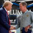 Republican presidential nominee former President Donald Trump shakes hands with Georgia Gov. Brian Kemp after speaking at a temporary relief shelter as he visits areas impacted by Hurricane Helene, Friday, Oct. 4, 2024, in Evans, Ga. (AP Photo/Evan Vucci)