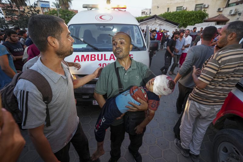 Palestinians wounded in the Israeli bombardment of the Gaza Strip are brought to a hospital in Deir al Balah on Tuesday, June 4, 2024. (AP Photo/Abdel Kareem Hana)
