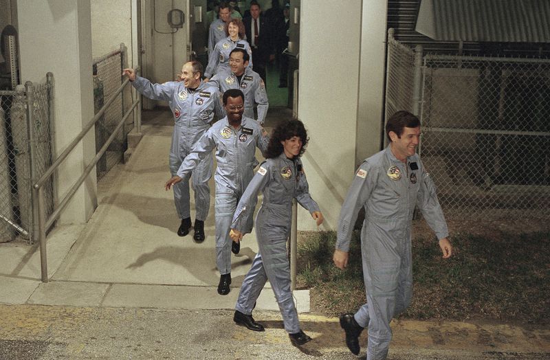 FILE - The crew for the Space Shuttle Challenger flight 51-L leaves their quarters for the launch pad, Jan. 27, 1986, at the Kennedy Space Center in Florida. Front to back are Commander Francis Scobee, Mission Spl. Judith Resnik, Mission Spl. Ronald McNair, Payload Spl. Gregory Jarvis, Mission Spl. Ellison Onizuka, teacher Christa McAuliffe, and pilot Michael Smith. (AP Photo/Steve Helber, File)