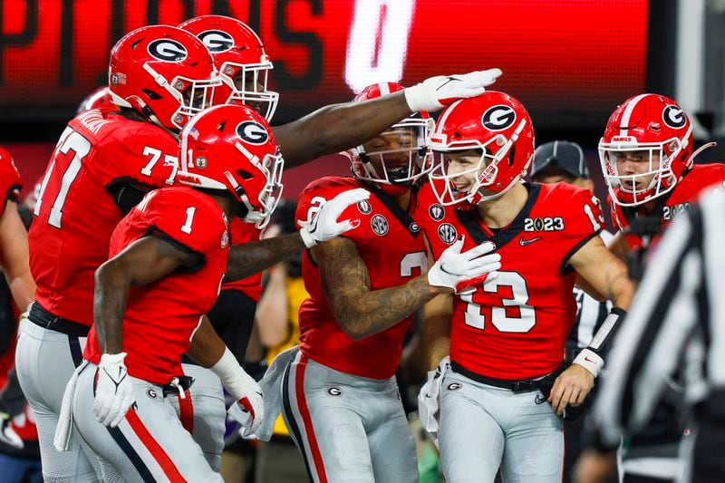 Georgia Bulldogs quarterback Stetson Bennett (13) celebrates a six-yard touchdown against the TCU Horned Frogs during the first half of the College Football Playoff National Championship at SoFi Stadium in Los Angeles on Monday, January 9, 2023. (Jason Getz / Jason.Getz@ajc.com)