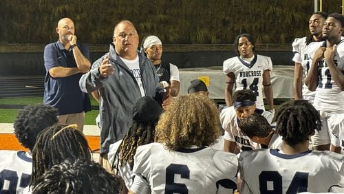 Norcross coach Keith Maloof talks to his team after its 31-10 win over Lanier, Aug. 17, 2024.