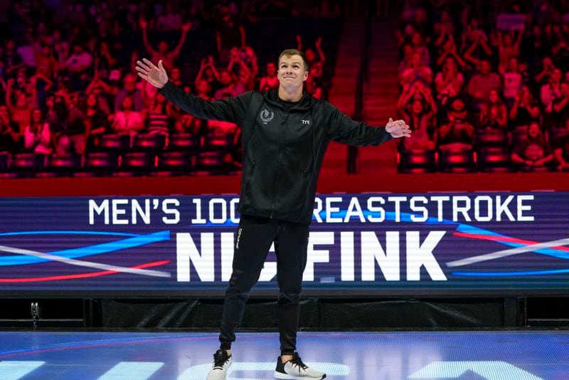 Nic Fink reacts after winning the men's 100 breaststroke finals Sunday, June 16, 2024, at the US Swimming Olympic Trials in Indianapolis. (AP Photo/Michael Conroy)